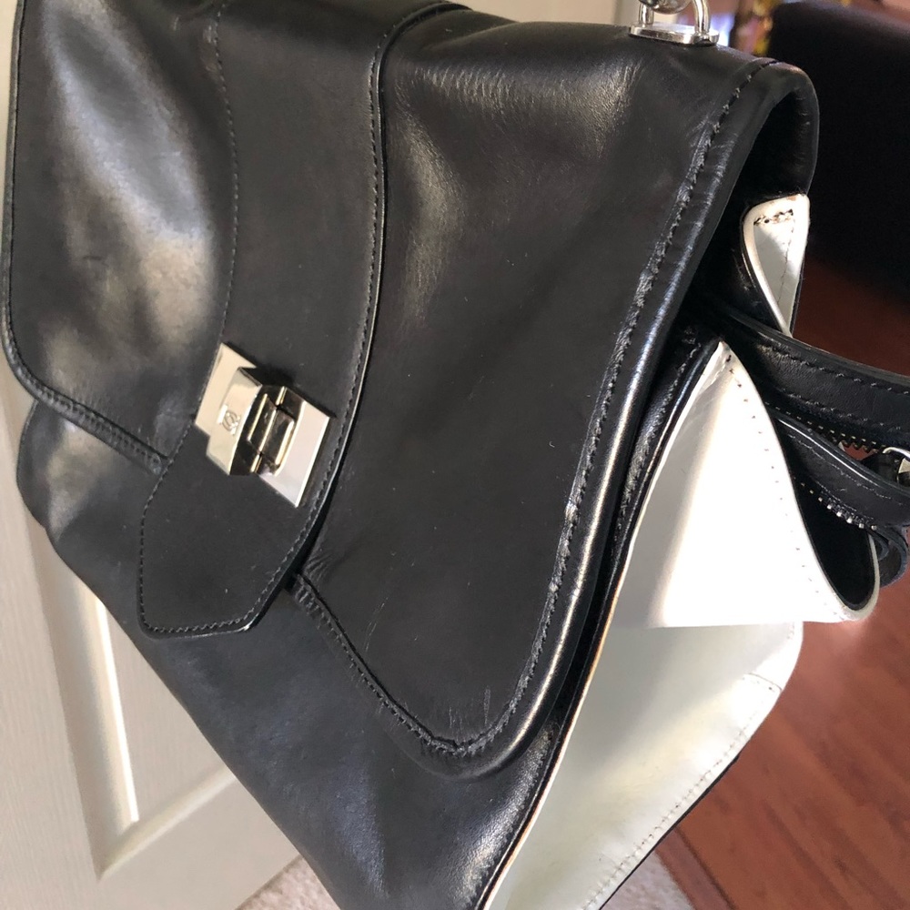 Beautiful Black and White Bebe handbag.